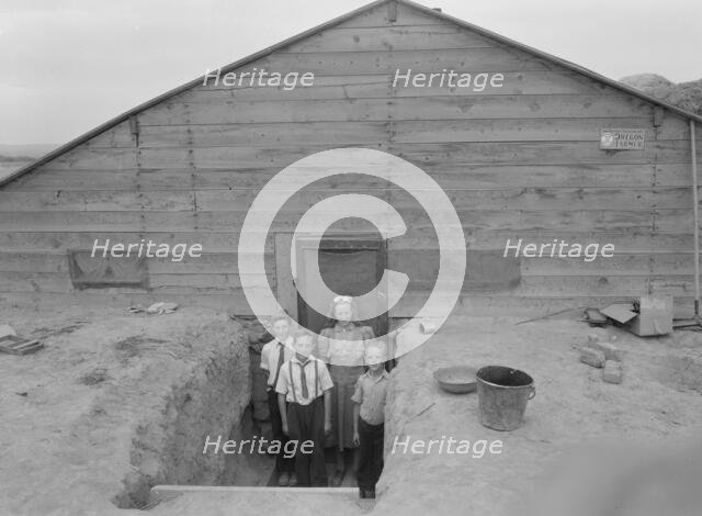 The Free children in doorway of their home in Sunday clothes, Dead Ox Flat, Oregon, 1939. Creator: Dorothea Lange.