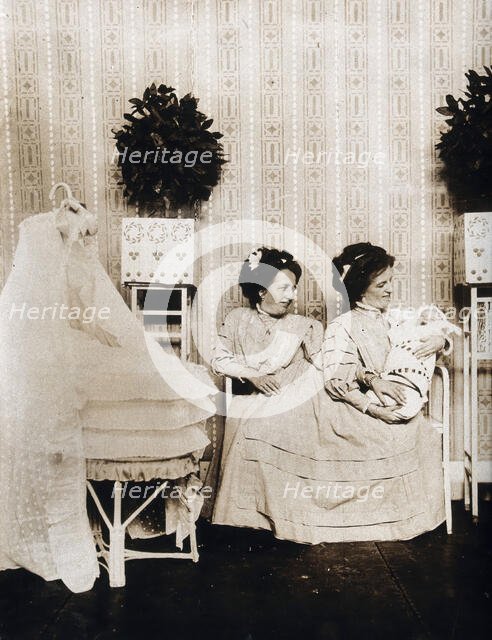 Josefa Blazek and Rosalia Blazek (Rosa Blazek), female conjoined twins, seated, holding...c1910. Creator: Unknown.