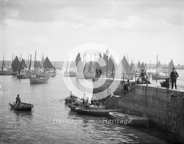 Fishermen unload their catches, Falmouth Pier, Falmouth, Cornwall, c1860-c1922. Artist: Henry Taunt