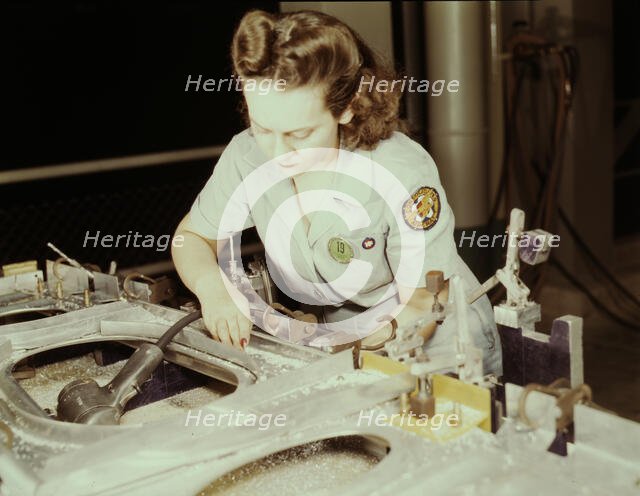 Drilling a wing bulkhead for a transport plane at the Consolidated Air..., Fort Worth, Texas, 1942. Creator: Howard Hollem.