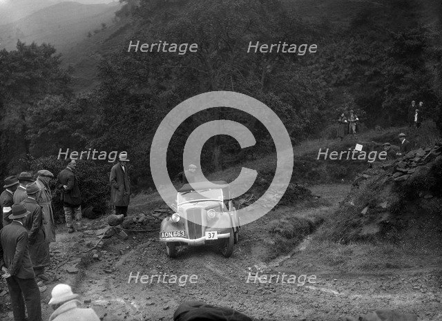 Ford 10 tourer of J Harrison competing in the MCC Sporting Trial, 1935. Artist: Bill Brunell.