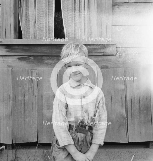 The youngest Arnold boy who also works at land clearing, Michigan Hill, Western Washington, 1939. Creator: Dorothea Lange.