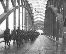 'Les Anglais sur le Rhin; A Cologne, Lanciers britanniques passant le Rhin a Cologne..., 1918. Creator: Jean Clair-Guyot.