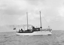 The 23 ton motor yacht 'Kiwi' under way, 1914. Creator: Kirk & Sons of Cowes.