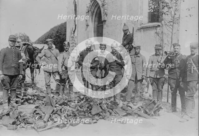 [Neufmont]iers, [F.], looking at battlefield booty, between c1914 and c1915. Creator: Bain News Service.