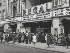 The movies are popular in the Negro section of Chicago, Illinois, April 1941. Creators: Farm Security Administration, Russell Lee.