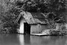 Wooden boathouse beside the River Rother, Woolbeding, West Sussex, c1900. Artist: Farnham Maxwell Lyte