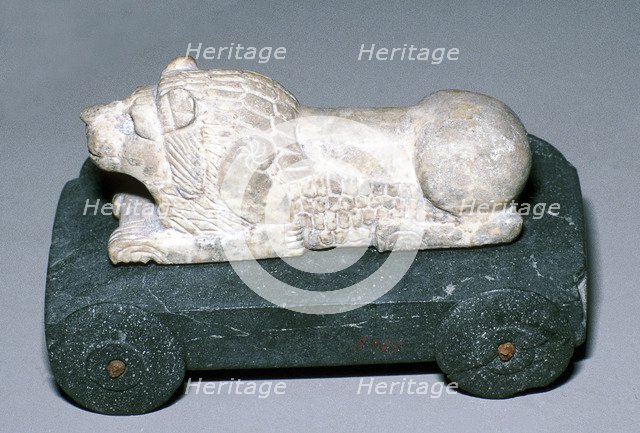 Limestone and bitumen lion mounted on a wheeled base, Susa, c12th century BC. Artist: Unknown