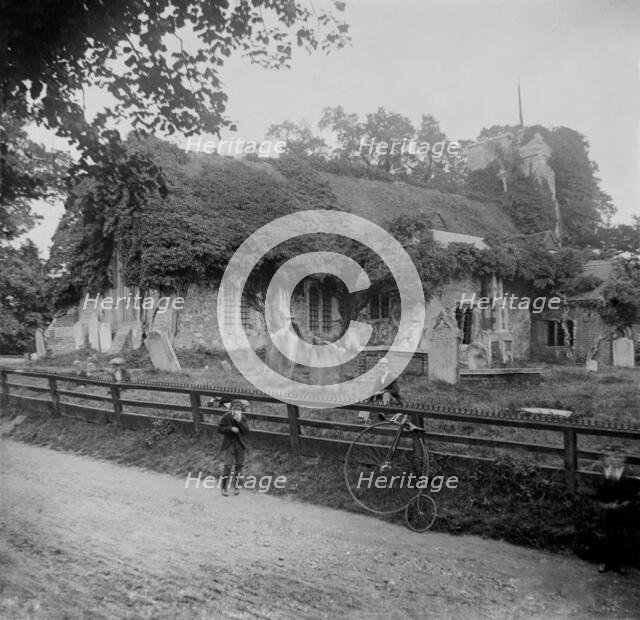 Abandoned stone church and penny-farthing bicycle, 1898. Creator: Robert Augustus Henry L'Estrange.