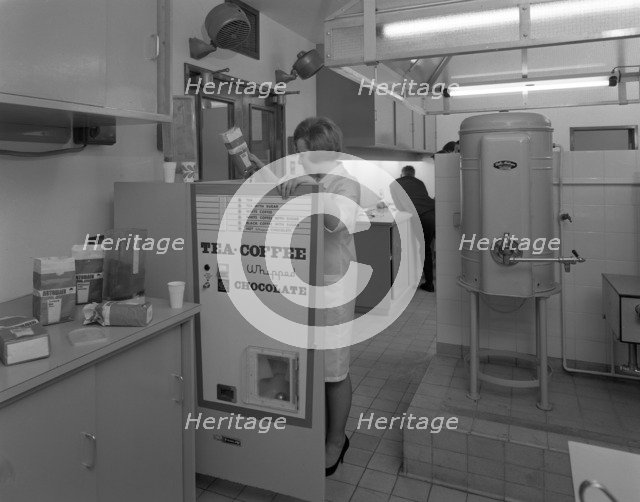 Loading a drinks vending machine at an experimental kitchen in Sheffield, South Yorkshire, 1966. Artist: Michael Walters