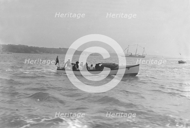 Modwena's motor launch with Modwena in the background, 1911. Creator: Kirk & Sons of Cowes.