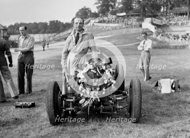 Raymond Mays with his ERA at Brooklands, Surrey, 1936. Artist: Bill Brunell.