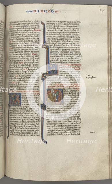 Fol. 317r, Baruch, historiated initial H, Baruch seated at a desk writing on a scroll, c. 1275-1300. Creator: Unknown.