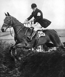 The Prince of Wales taking a fence in the bridge of Guards Challenge Cup race, c1930s. Artist: Unknown