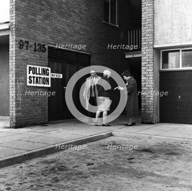People walking into a polling station, London, 1964. Artist: Henry Grant
