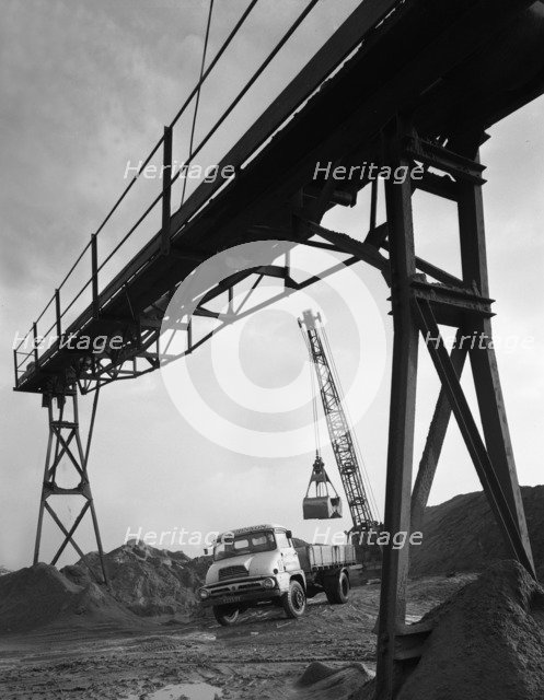 Loading a Ford Thames Trader tipper lorry, Finningley, near Doncaster, South Yorkshire, 1966. Artist: Michael Walters