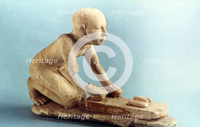Model of a baker kneading dough and forming loaves, Ancient Egyptian. Artist: Unknown