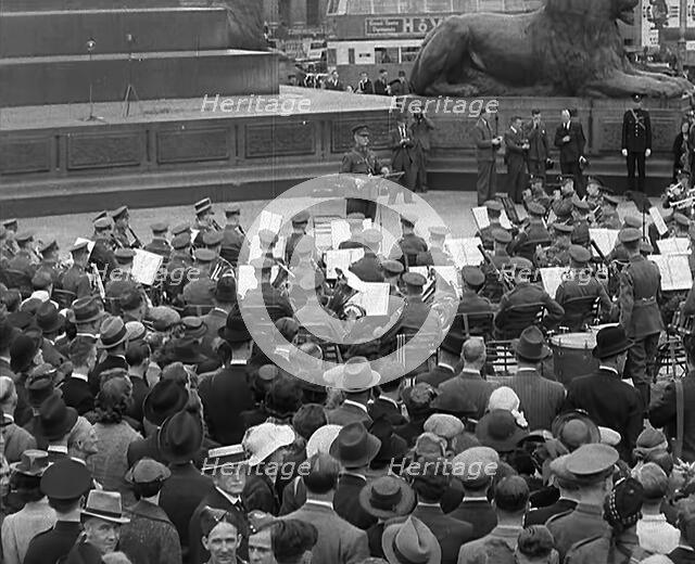 Crowds Listening to a Brass Band in Trafalgar Square, 1940. Creator: British Pathe Ltd.