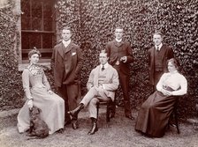 Claybury Asylum, Woodford, Essex: six members of staff, and a dog, (1893?). Creator: London & County Photographic Co.