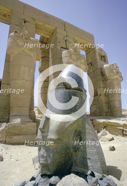 Granite head of Rameses II in front of the Ramesseum, Luxor (Thebes), Egypt. Artist: Tony Evans