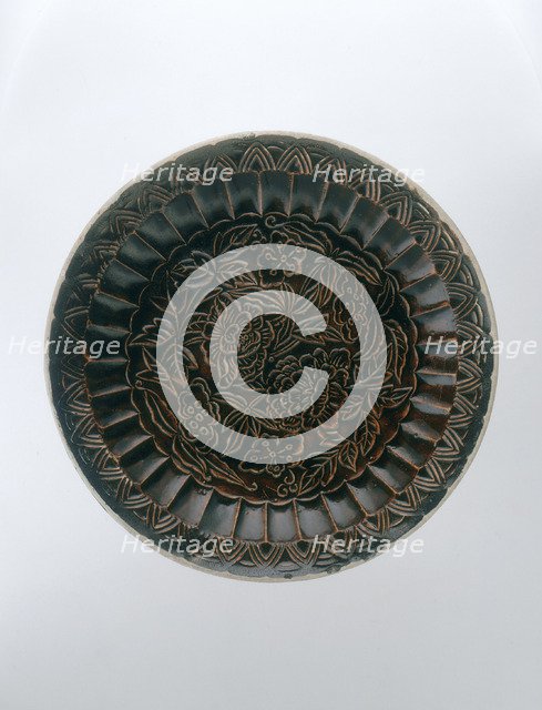 Brown Ding saucer with moulded floral decoration, Jin dynasty, China, late 12th-early 13th century. Artist: Unknown