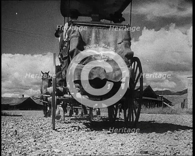 Coach and Horses Waiting To Pick up Passengers Arriving Off the Train, 1932. Creator: British Pathe Ltd.