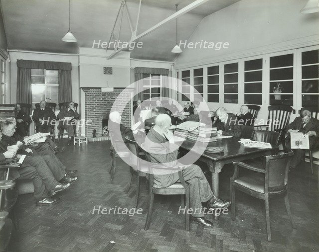 Men sitting in the library at Cedars Lodge old people's home, Wandsworth, London, 1939. Artist: Unknown.