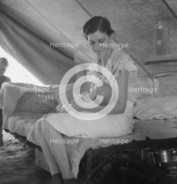 Young migrant mother with six weeks old baby born in a hospital with aid..., near Westley, CA, 1939. Creator: Dorothea Lange.