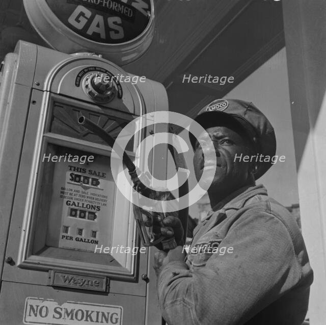 Negro mechanic for the Amoco oil company, Washington, D.C., 1942. Creator: Gordon Parks.
