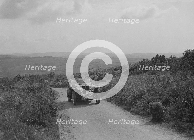 MG TA of JL Lutwyche competing in the MCC Torquay Rally, 1938. Artist: Bill Brunell.
