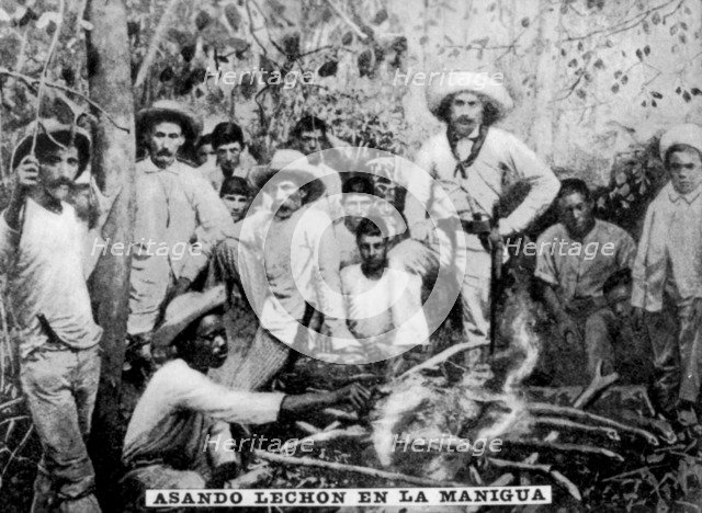 Roasting pig in the jungle, Cuba, (c1910). Artist: Unknown