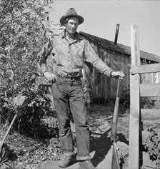 Roy Carlock, member of Ola self-help sawmill co-op, in front of his new..., Gem County, Idaho, 1939. Creator: Dorothea Lange.