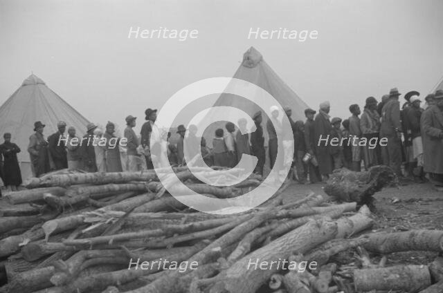 Possibly: Negroes in the lineup for food at meal time in the camp..., Forrest City, Arkansas, 1937. Creator: Walker Evans.