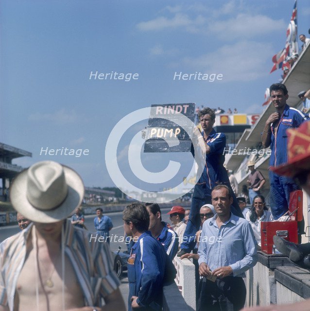 A mechanic holding up a sign, French Grand Prix, Le Mans, France, 1967. Artist: Unknown