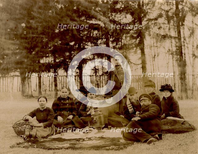 G.V. Iudina's Family with Their Guests in the Garden at the Dacha in Tarakanovo, 1907. Creator: Unknown.