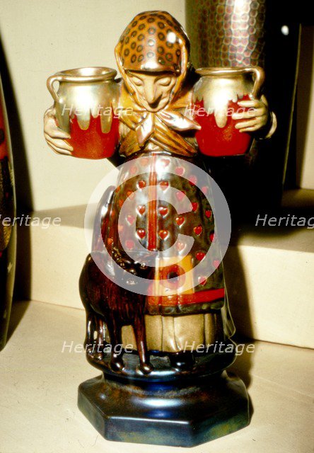 Witch and Cat: Pottery figure from Pecs, Hungary. 19th century. Artist: Unknown.