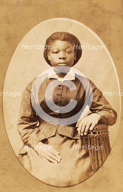 Studio portrait of young woman with thin ribbon around neck, (1880-1889?). Creator: A. T. Hunt.