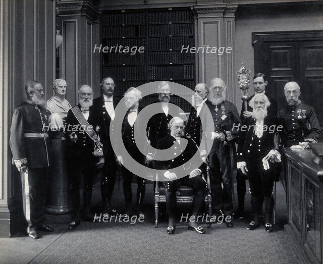 Fellows of the Royal Society: Sir John Evans, bust of Sir Isaac Newton, Lord Kelvin, RB Clifton... Creator: Mayall.