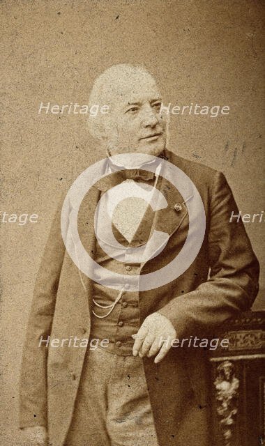 An unidentified man leaning on a cabinet, c1880s. Creator: Frederick Mulnier.