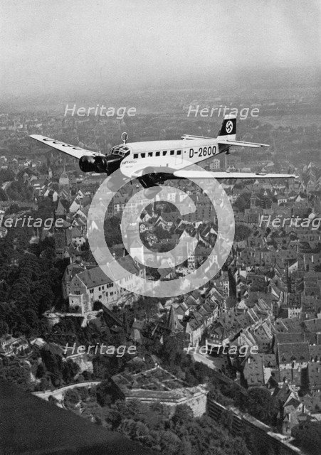 Junkers Ju 52 aircraft D-2600 over Nuremberg, Germany, 1934. Artist: Unknown