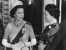 Queen Elizabeth II chatting with Mrs Gandhi during a reception at Buckingham Palace, 1969.  Creator: Unknown.