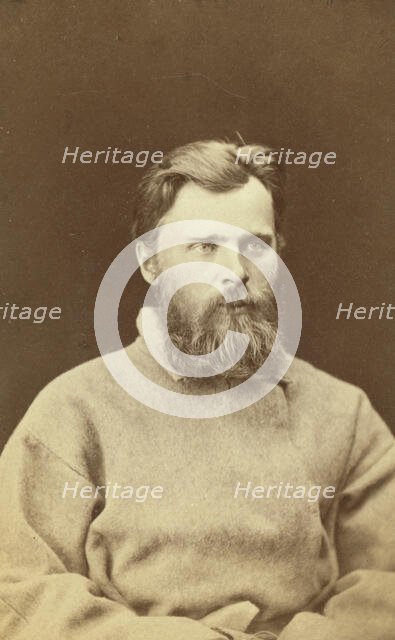 Half-length portrait of a man, dressed in convict clothing, facing right, between 1880 and 1886. Creator: Unknown.