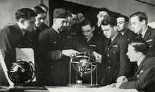 RAF personnel learning navigation during the Second World War, 1941. Creator: Charles Brown.