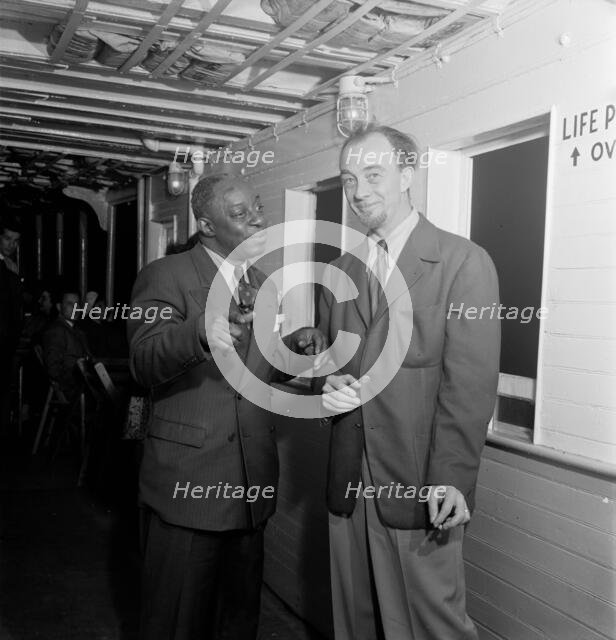 Portrait of Rudi Blesh and Baby Dodds, Riverboat on the Hudson, N.Y., ca. July 1947. Creator: William Paul Gottlieb.