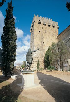 Archbishop tower 197 ad.C and statue of Emperor Augustus alongside the city walls built by the Ro…