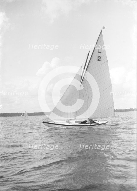 The 6 Metre Cynthia sailing upwind, 1912. Creator: Kirk & Sons of Cowes.