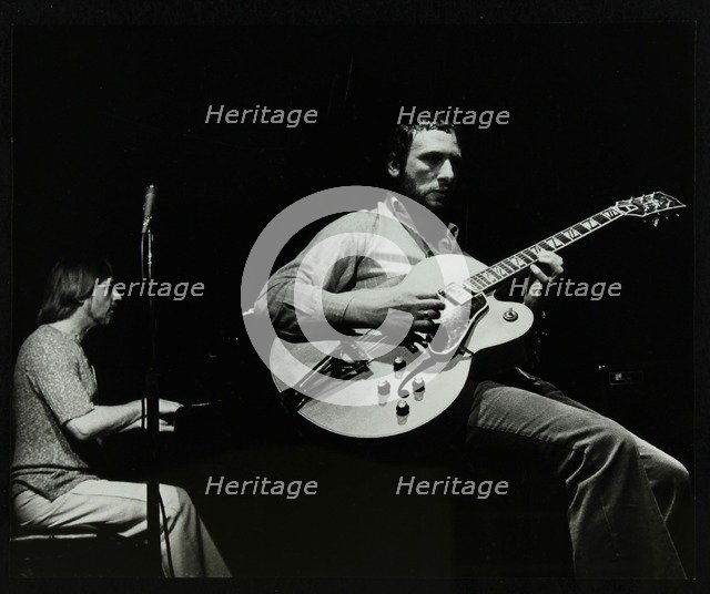 Phil Lee (guitar) and Michael Garrick (piano) playing at The Stables, Wavendon, Buckinghamshire. Artist: Denis Williams
