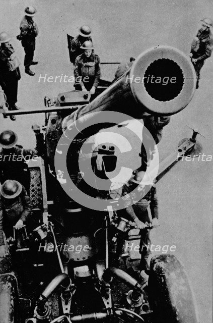 On target! - A 3.7 inch gun detachment at battle practice, 1943. Artist: Unknown.