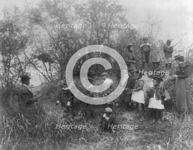 Whittier School students on a field trip studying plants, Hampton, Virginia, 1899. Creator: Frances Benjamin Johnston.