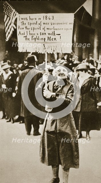 Woman holding a placard in support of the war effort, USA, World War I, c1914-c1918. Artist: Unknown